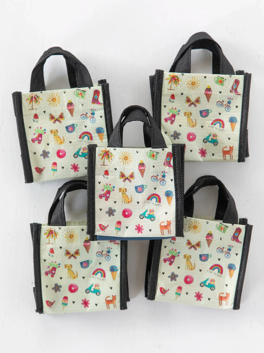 Set of small bags with colorful patterns on a white background