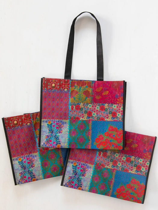 Colorful patchwork tote bag on a white background