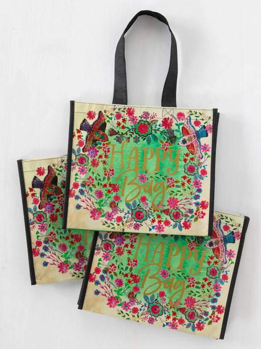 Two floral tote bags with 'Happy Bug' text on a white background