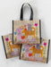 Set of three colorful tote bags with animal designs on a white background
