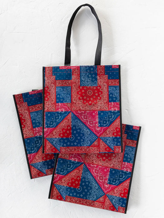 Set of three bags with red and blue pattern on a white background