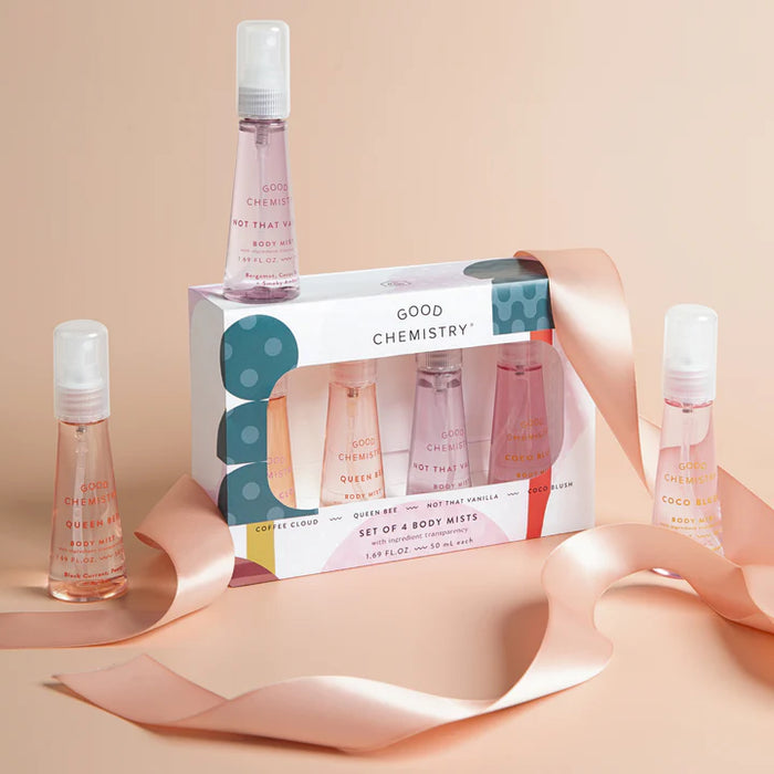 Set of four body mist bottles with a packaging box labeled 'Good Chemistry' on a beige background.