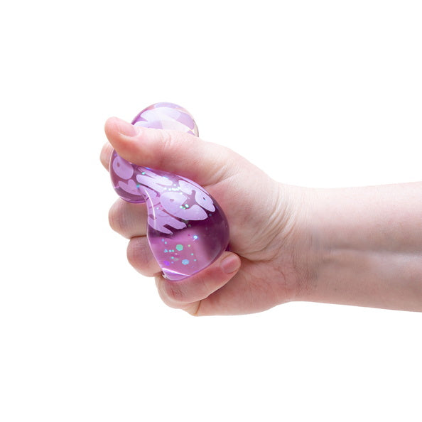Hand holding a purple stress ball against a white background