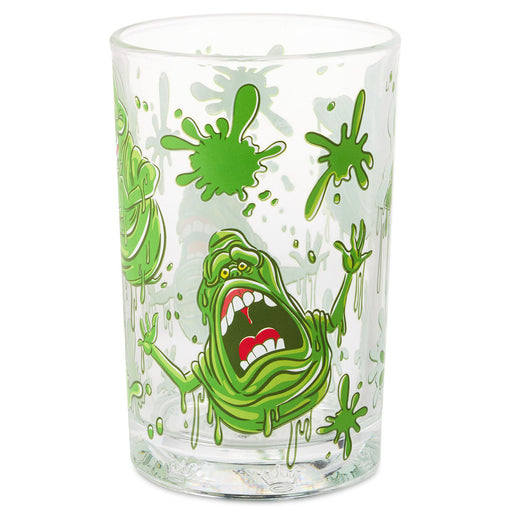 A clear glass drinking tumbler featuring a green slime monster graphic inspired by Ghostbusters, with green splatters and drips on a white background.