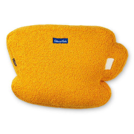 Yellow fleece pillow with a visible brand label on a white background