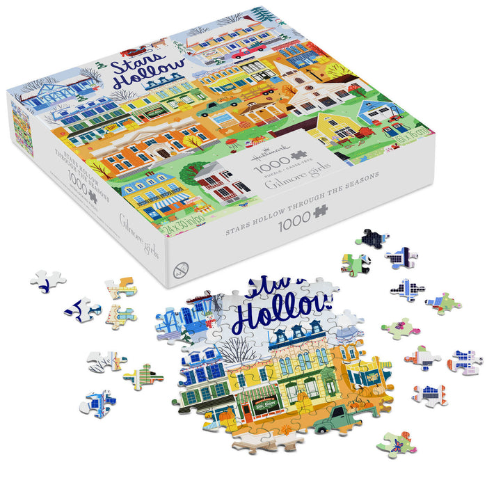 Jigsaw puzzle packaging with 'Stars Hollow' illustration and scattered pieces on a white background