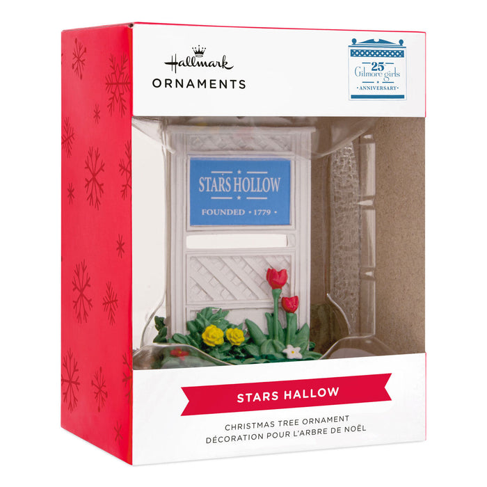 Hallmark Christmas ornament packaging with 'Stars Hollow' sign and flowers.