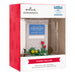 Hallmark Christmas ornament packaging with 'Stars Hollow' sign and flowers.