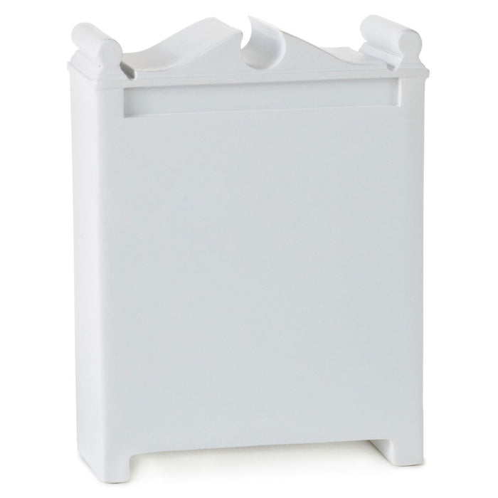 White decorative item with a triangular top on a white background