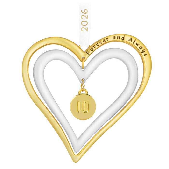 Heart-shaped ornament with gold and white colors, featuring 'Forever and Always' text and a small pendant.