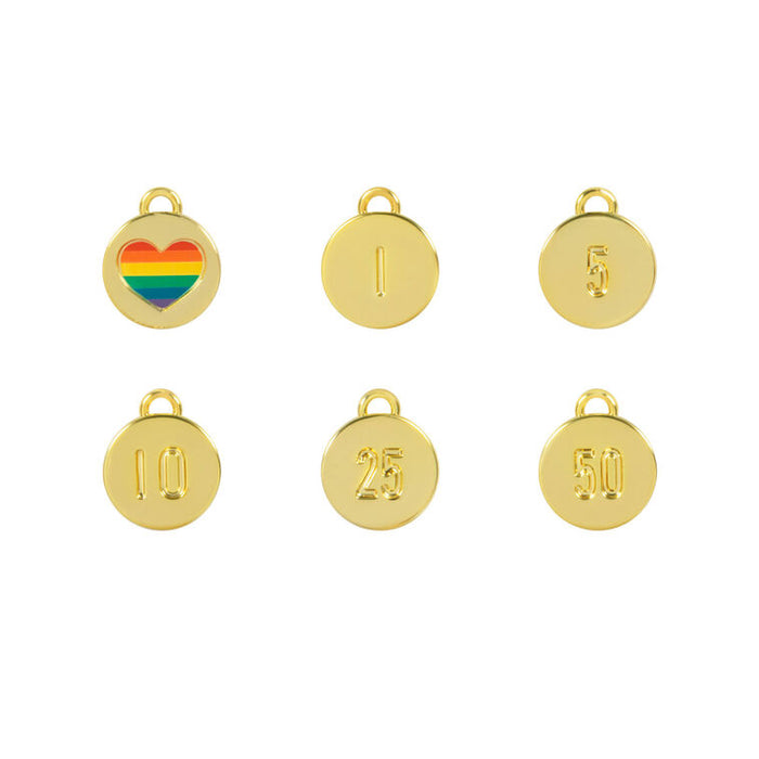 Set of gold charms with numbers and a rainbow heart on a white background