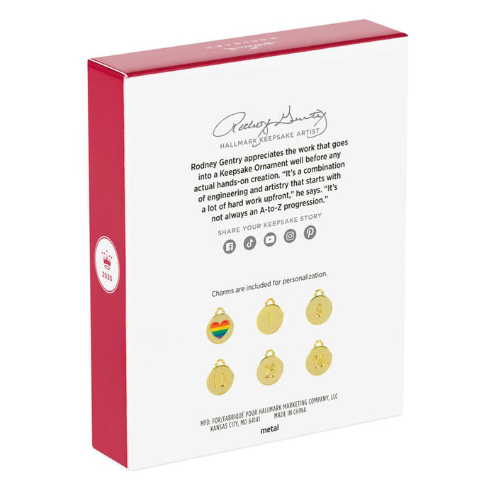 Hallmark Keepsake Ornament packaging with red and white design, featuring a quote and images of charms.