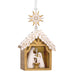 Decorative nativity scene in a wooden stable with a gold star on a white background