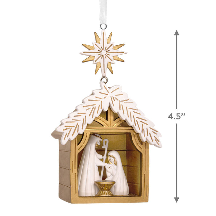 Decorative nativity scene ornament with measurement details on a white background