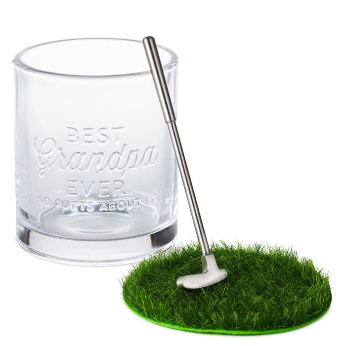 Clear glass with 'Best Grandpa Ever' engraving, golf club, and grass patch on a white background