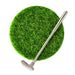 Golf club on a green grassy patch with a white background