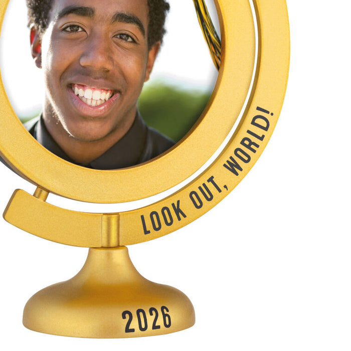 Gold mirror with 'Look Out, World! 2026' text and a person's reflection.