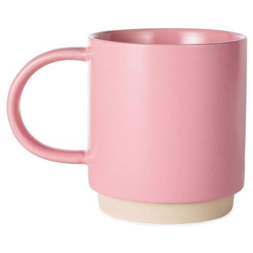 Pink mug with a beige base on a white background