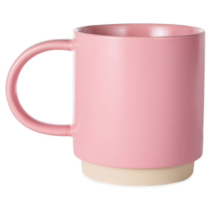 Pink mug with a beige base on a white background