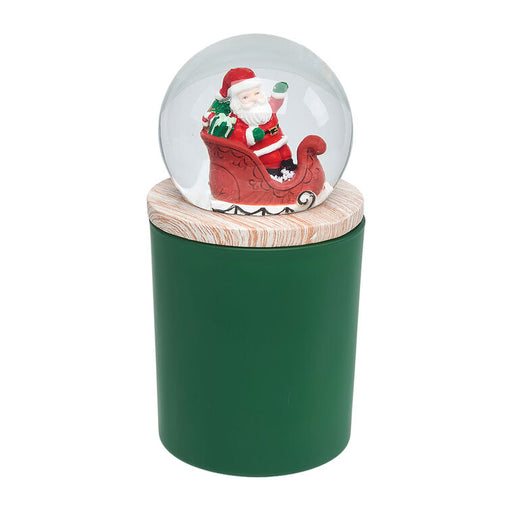Christmas-themed snow globe with Santa Claus on a green stand
