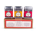 Three Spicewalla spice containers on a cardboard stand with product descriptions.