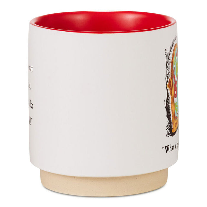 A white ceramic mug with a vibrant red interior and a natural beige clay foot ring. The side of the mug features black text and a colorful graphic illustration.