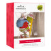 Hallmark The Grinch Christmas ornament packaging with red and white design.