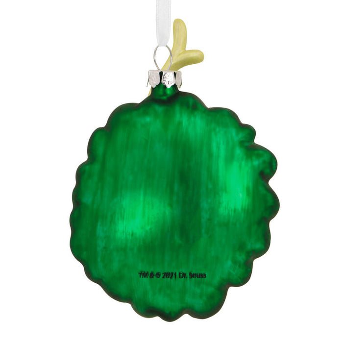 Green ornament with a white ribbon on a white background