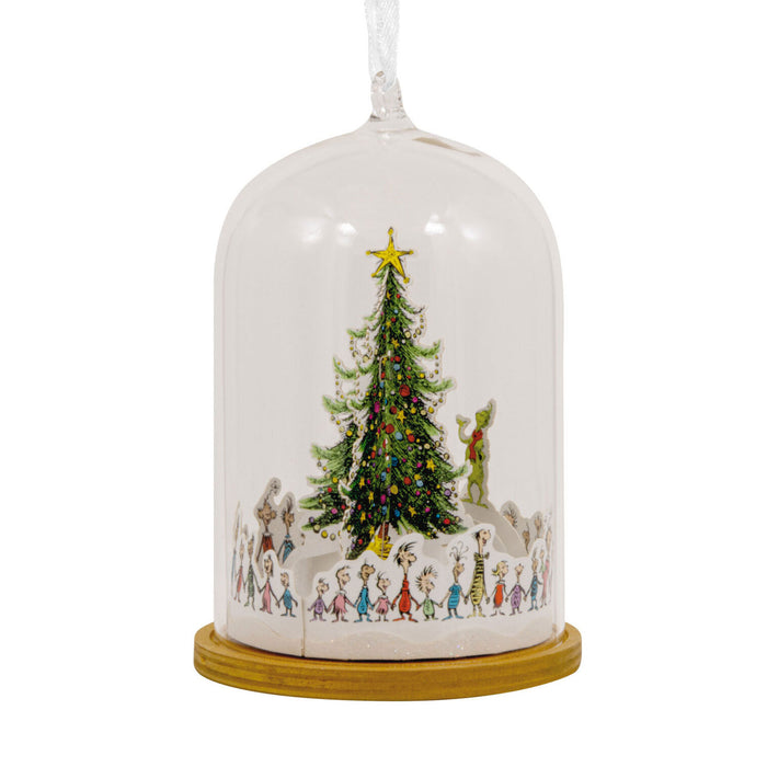Decorative Christmas scene under a glass dome with a tree and characters on a white background