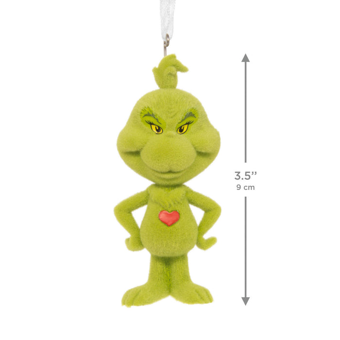 A green Grinch-style plush ornament with a small red heart on the chest and a white hanging loop, shown on a white background with a vertical dimension arrow and text reading 3.5 inches (9 cm).