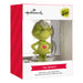 Hallmark The Grinch Christmas Tree Ornament in its original retail packaging, featuring a green plush Grinch figure inside a clear window box with red and white branding.