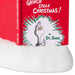 A close-up of a Dr. Seuss 'Grinch Stole Christmas!' book standing upright on a white faux-snow surface, with the red cover and spine visible against a white background.
