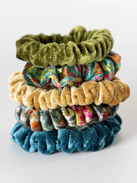 Stack of colorful scrunchies on a white background