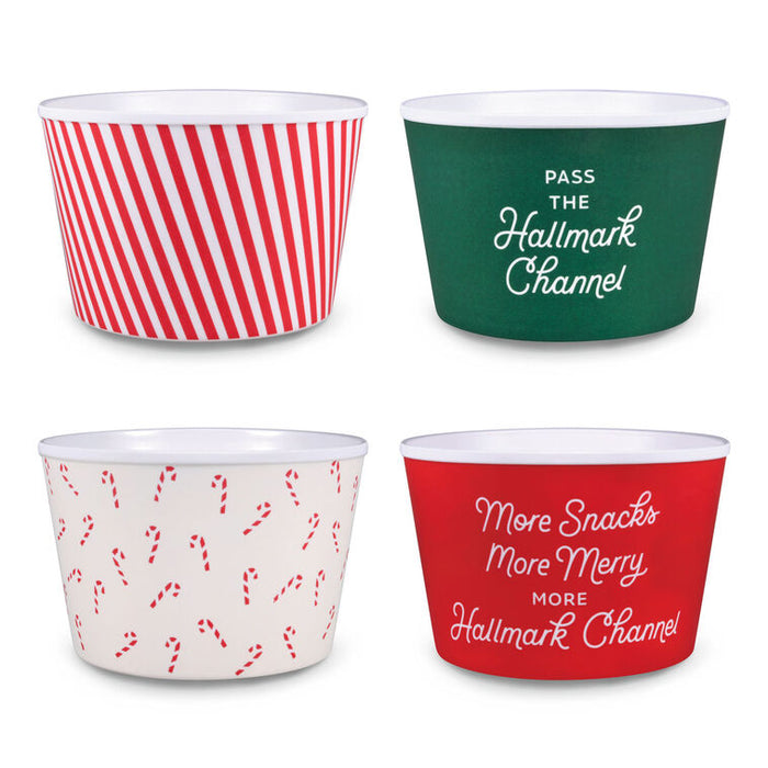 Four festive-themed cups with red, green, and candy cane patterns on a white background.