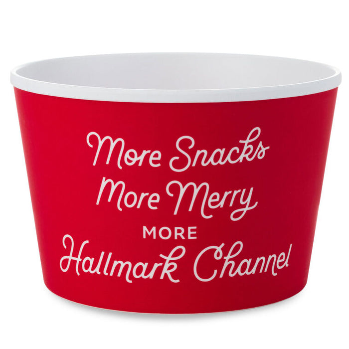 Red bowl with white text 'More Snacks More Merry More Hallmark Channel' on a white background