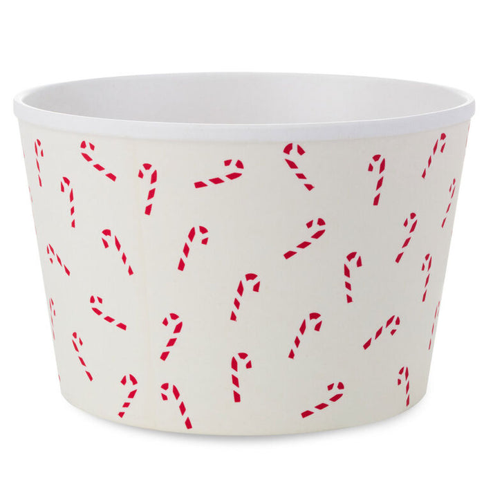 White container with red candy cane pattern on a white background