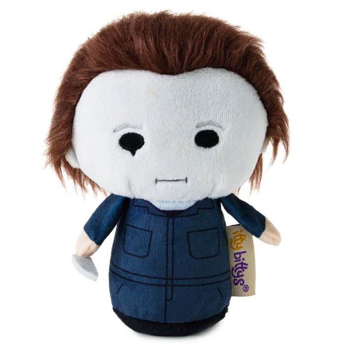 A Michael Myers plush toy  featuring brown hair, a white face, and a blue jumpsuit.