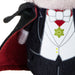 Close-up of a plush vampire costume or doll torso with a black cape, white tuxedo-style vest, red inner lining, white bow tie, and a green flower emblem on a white background.