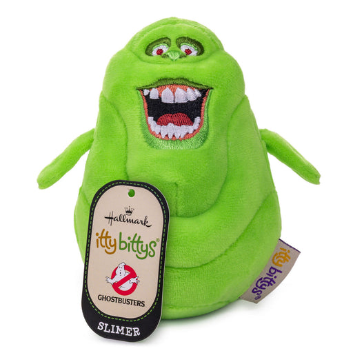 A green plush toy of the Ghostbusters Slimer character, featuring embroidered details, a large open mouth with white teeth, and a hanging Hallmark Itty Bittys Ghostbusters tag.