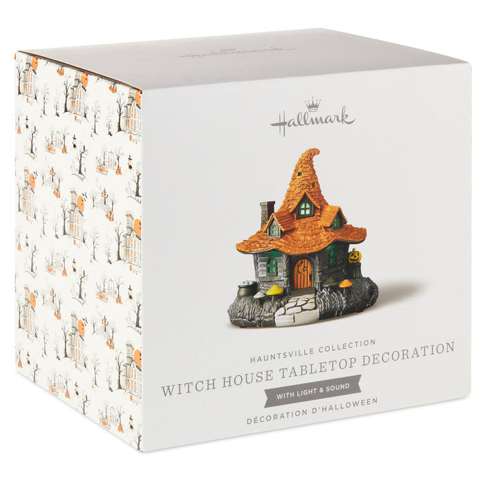 Hallmark Hauntsville Collection Witch House Tabletop Decoration in its original white packaging box, featuring a printed illustration of the witch house and product details on the front.