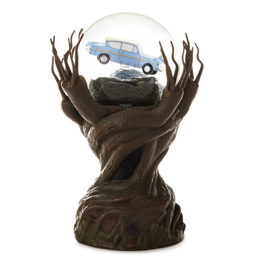 A decorative tree-bark style display base holding a clear glass globe with a small blue car inside, photographed on a plain white background.