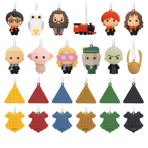 Collection of colorful character and object-shaped keychains on a white background