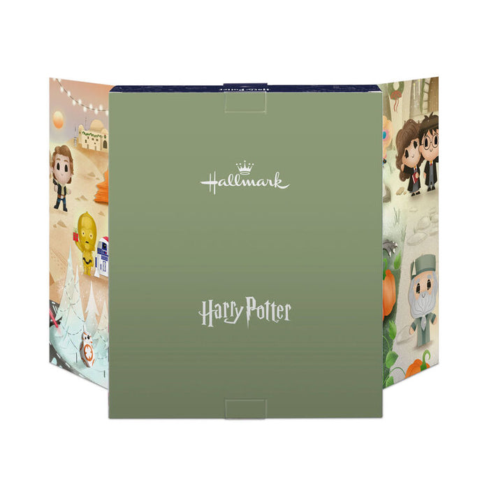 A Hallmark Harry Potter advent calendar box shown open, with a muted sage green front panel and colorful illustrated side panels featuring Harry, Ron, Hermione, Dumbledore, and other characters.