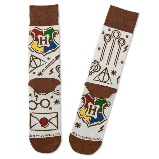 Pair of socks with Harry Potter-themed designs on a white background
