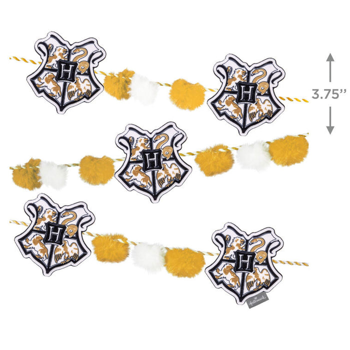 Decorative garland with Hogwarts crest design on a white background