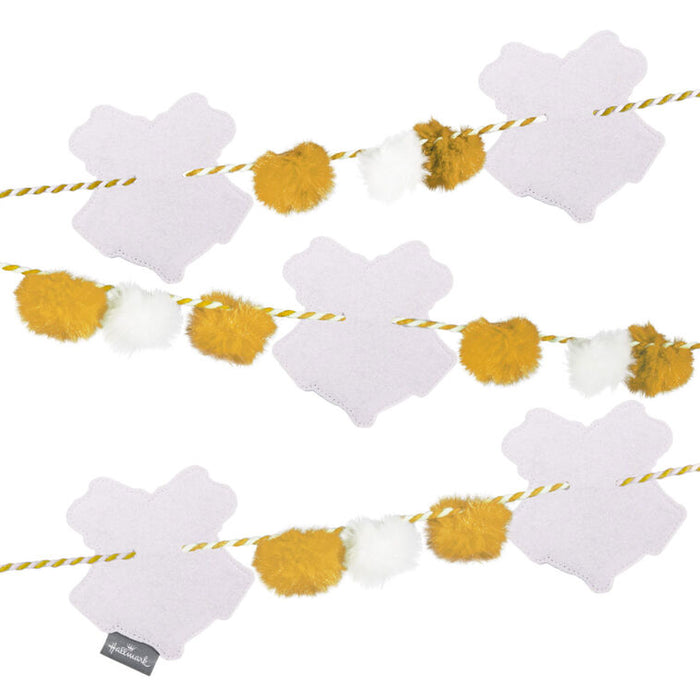 Decorative garland with white hearts and yellow pom-poms on a white background