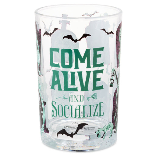 A clear glass tumbler with a Halloween-themed design featuring the text 'COME ALIVE AND SOCIALIZE' in green, black bats, a cross, and spooky illustrations on a white background.