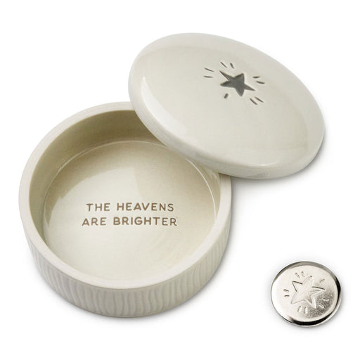 Ceramic box with 'The Heavens Are Brighter' text and a matching button on a white background