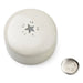 Round white container with star design on lid and matching round object on a white background
