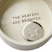 Ceramic dish with engraved text 'The Heavens Are Brighter' and a star design.